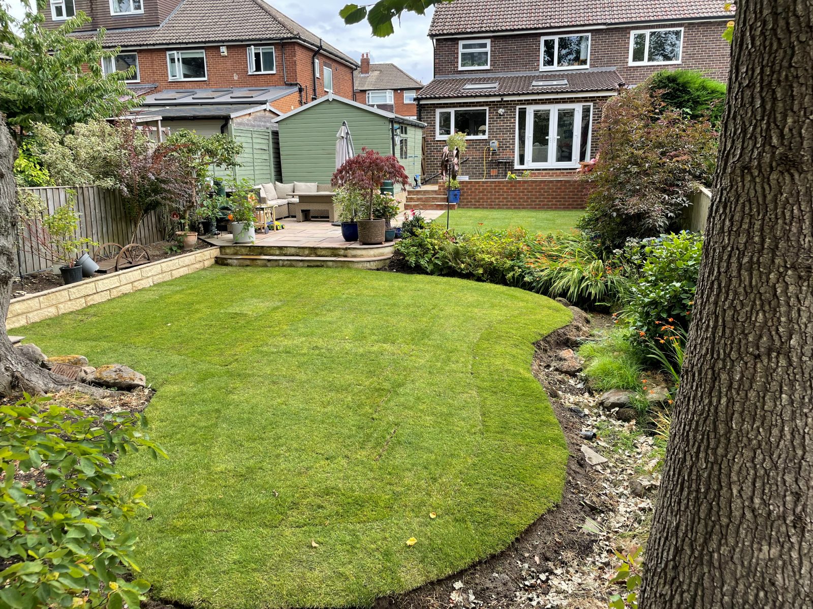 Curved new turf lawn in an established Leeds garden