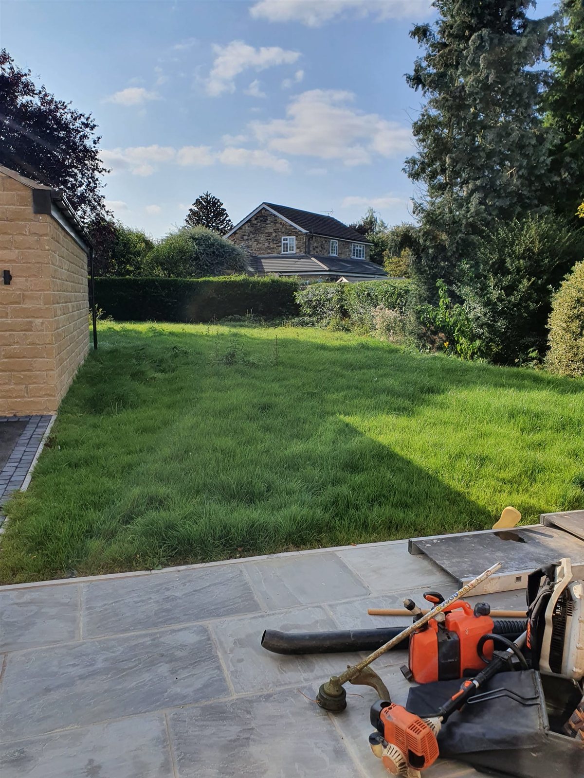 Freshly laid turf installation by Apex Landscapes